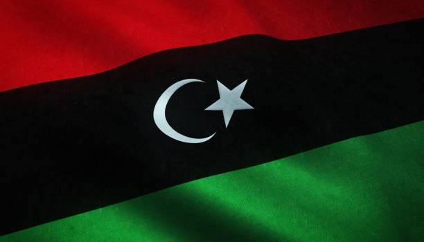 nahaufnahme der wehenden flagge libyens mit interessanten texturen - libya flag libyan flag three dimensional shape stock-fotos und bilder