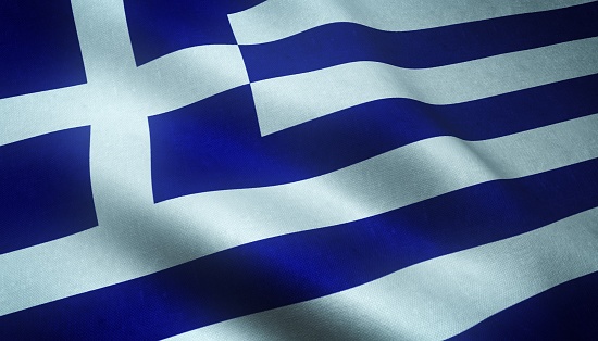 A closeup shot of the waving flag of Greece with interesting textures