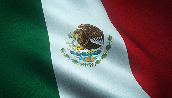 A closeup shot of the waving flag of Mexico with interesting textures