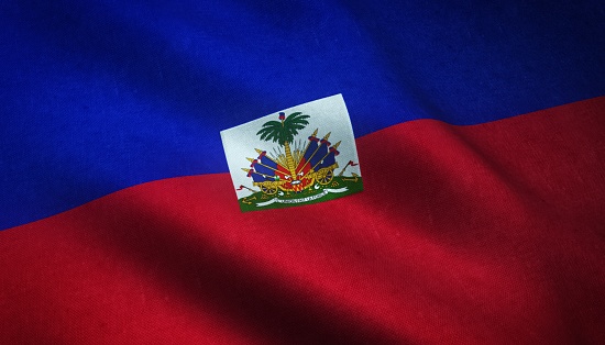 A closeup shot of the waving flag of Haiti with interesting textures
