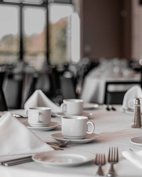 istock Vertical shot of neat tables in a nice, empty and clean restaurant 1438868278
