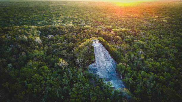 Aerial Drone Above Coba Ruins Yucatan Peninsula Mexico Aerial Drone Above Coba Ruins Yucatan Peninsula Mexico Ceremonial Mesoamerican Zone peninsula stock pictures, royalty-free photos & images