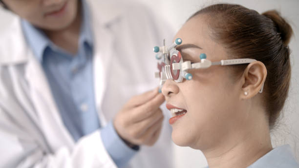 istock Asian elderly woman measuring her eyesight 1438869163