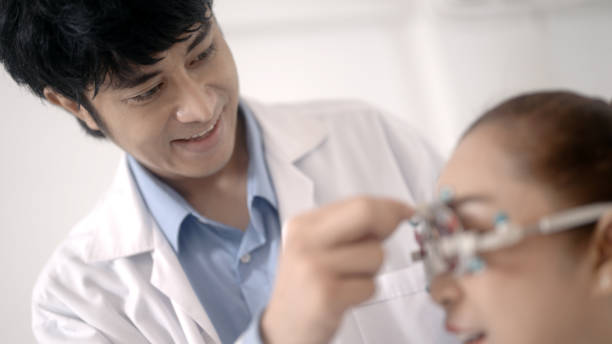 istock Asian elderly woman measuring her eyesight 1438869164