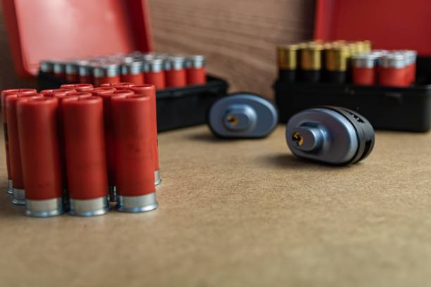 istock Selective focus shot of red shotgun ammo on a brown surface 1438871293