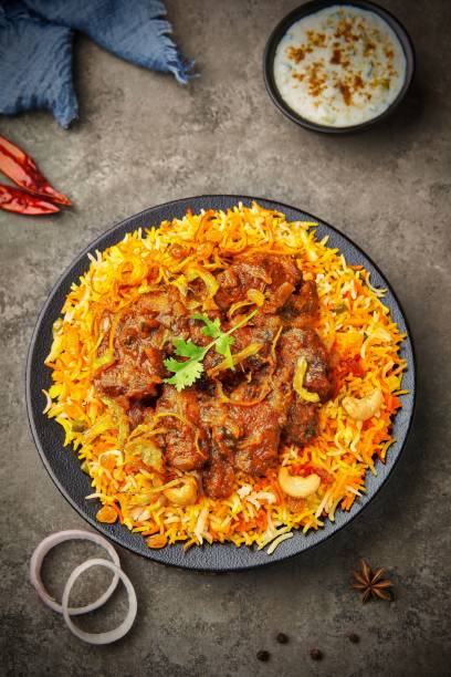 istock Top view of delicious chicken biryani with ingredients 1438872265