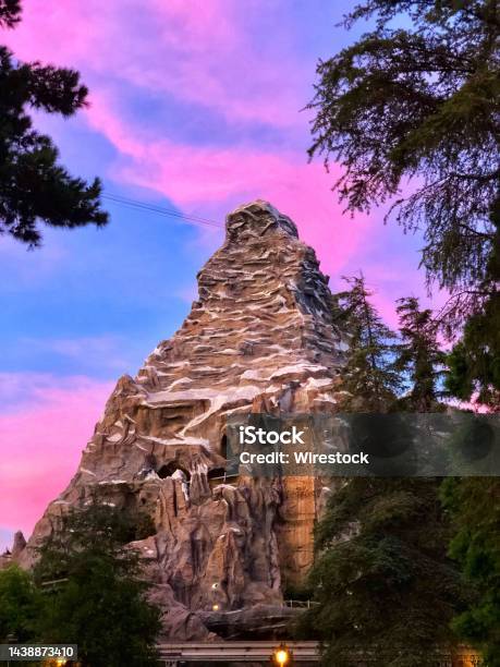 Vertical Shot Of The Matterhorn Bobsleds Under Sunset Colorful Sky In Anaheim California Stock Photo - Download Image Now