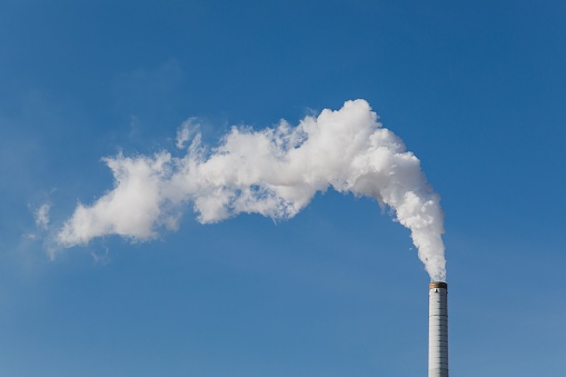 A smoke get out of industrial chimney is a symbol for climate change and pollution