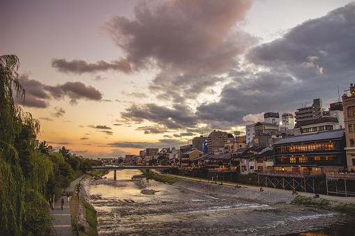 A breathtaking scenery of sunset over Kamogawa river in Kyoto, Japan