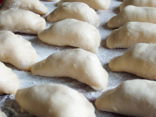 istock cooking. Dumplings with cheese. Ready for cooking dumplings with cottage cheese. 1438874942