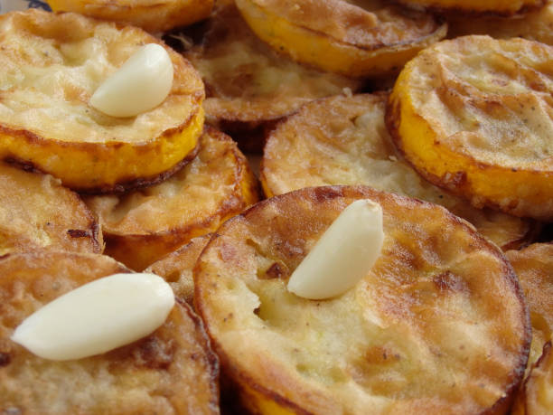 istock Fried Courgettes With Garlic. Fried zucchini, top view 1438875356
