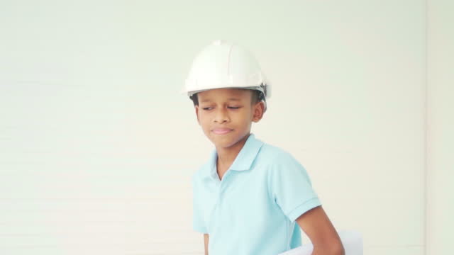 Teenage boy pretending to be a engineer