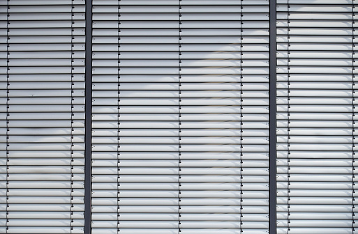 Photograph of a new metal louver of an office building.