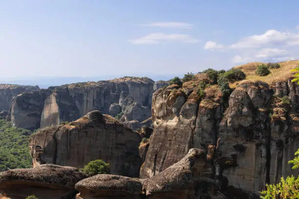 Photo of The structure on the face of the monoliths in this image is evidence of water-borne sediment being deposited in sequences. Meteora, Central Greece