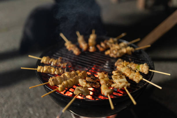 istock Japanese Yakitori grilling on a bbq outdoors at night 1438877307