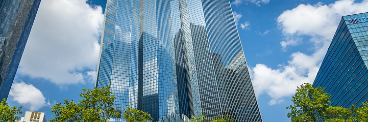 Glass windows of Total Energies headquarters tower in La Defense district in Paris, France