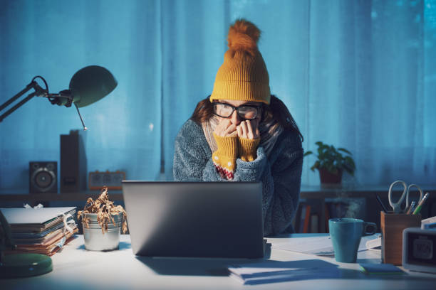 istock Woman feeling cold at home in winter 1438880817