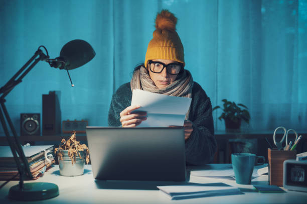 istock Woman checking expensive utility bills 1438880913
