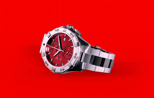 Red wristwatch isolated on red background