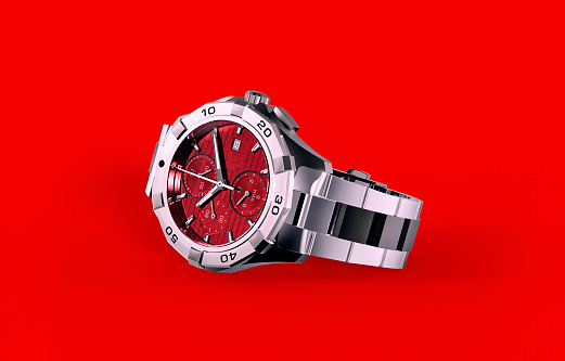 Stainless steel Red wristwatch isolated on red background