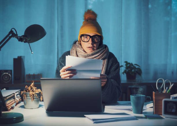istock Woman checking expensive utility bills 1438881911