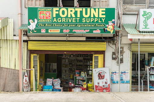 Dimiao, Bohol, Philippines - May 2022: THe storefront of an agriculture supply store at the town.