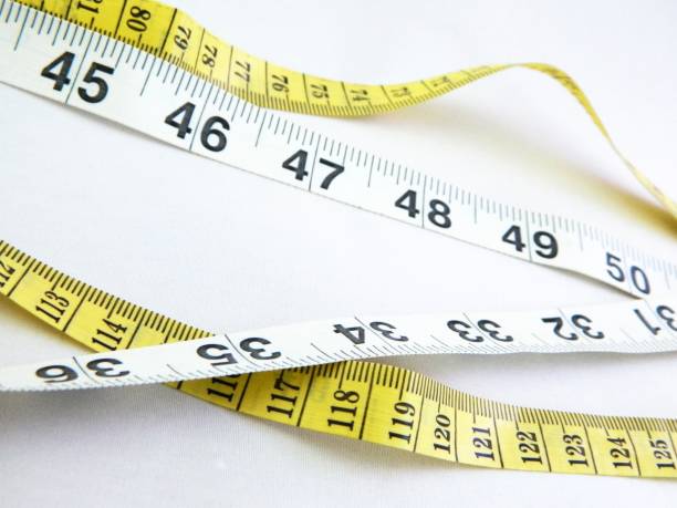 istock Body Measuring Ruler Inches and Centimeters 1438882773