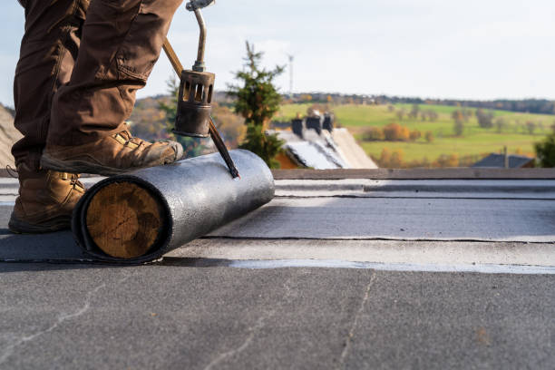 worker heating and melting bitumen roofing flat roof installation. - bitumen felt imagens e fotografias de stock