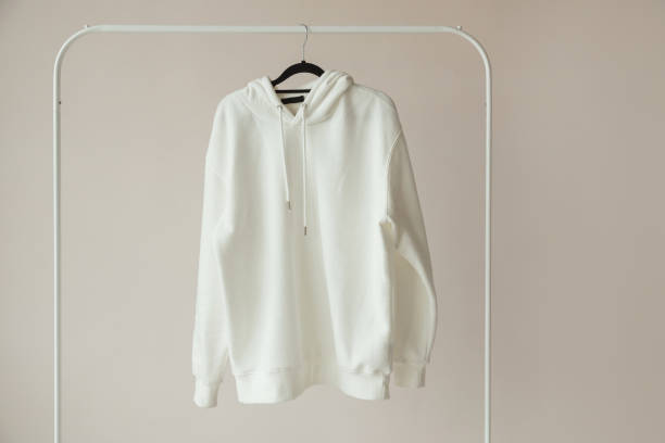 istock Blank White Hoodie, Sweatshirt Mock-up hanging on white Rack Hanger, front view 1438886276