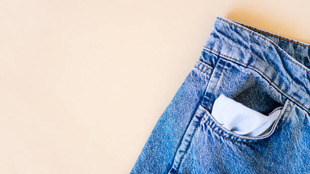 istock jeans on the background, blue and black jeans lie on a white background, 1438889438