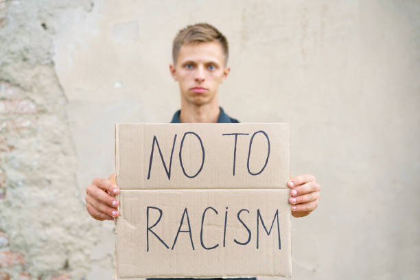 istock Caucasian guy came out to protest against racism 1438891784