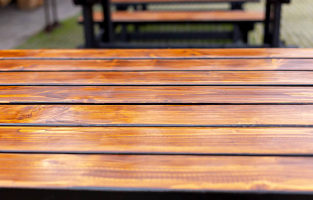 Beautiful wooden worktop made of boards. A podium for your product. Selective focus