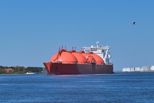 LNG or liquified natural gas tanker entering port on a sunny day in Klaipeda, Lithuania. Alternative gas supply, commercial freight, energy crisis