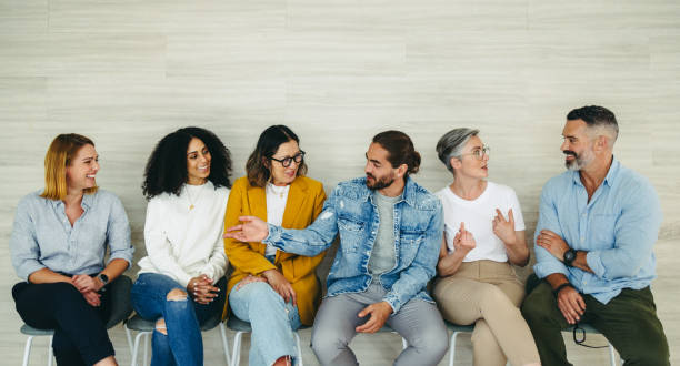 istock Happy businesspeople talking to each other before an interview 1438894981