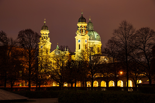 Illuminated Theatinerkirche or Theatine church at night in Munich, Bavaria, Germany