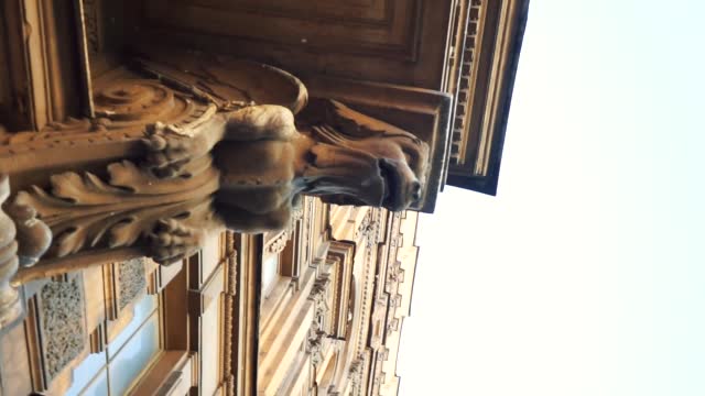 sculpture of an animal under a balcony in the city center of St. Petersburg