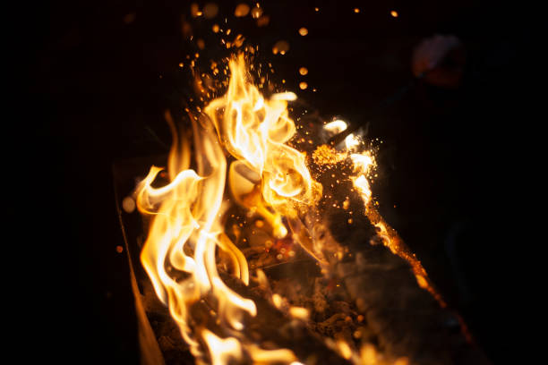istock Flames of pyre. Fire in dark. Burning firewood. 1438900941