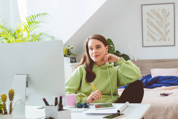 Woman working at home stock photo