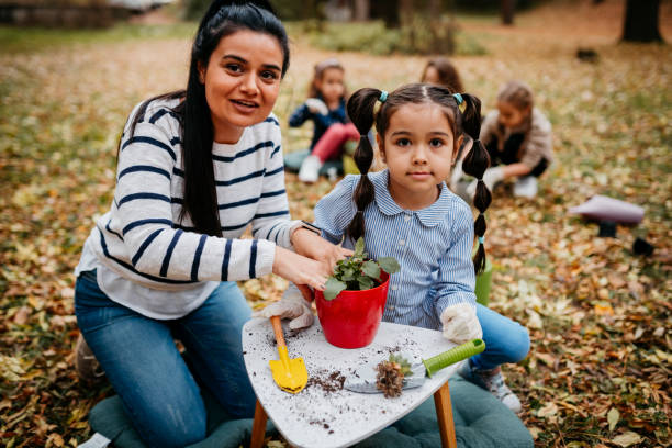 istock Mother and Daughter Planting Seedlings 1438901203