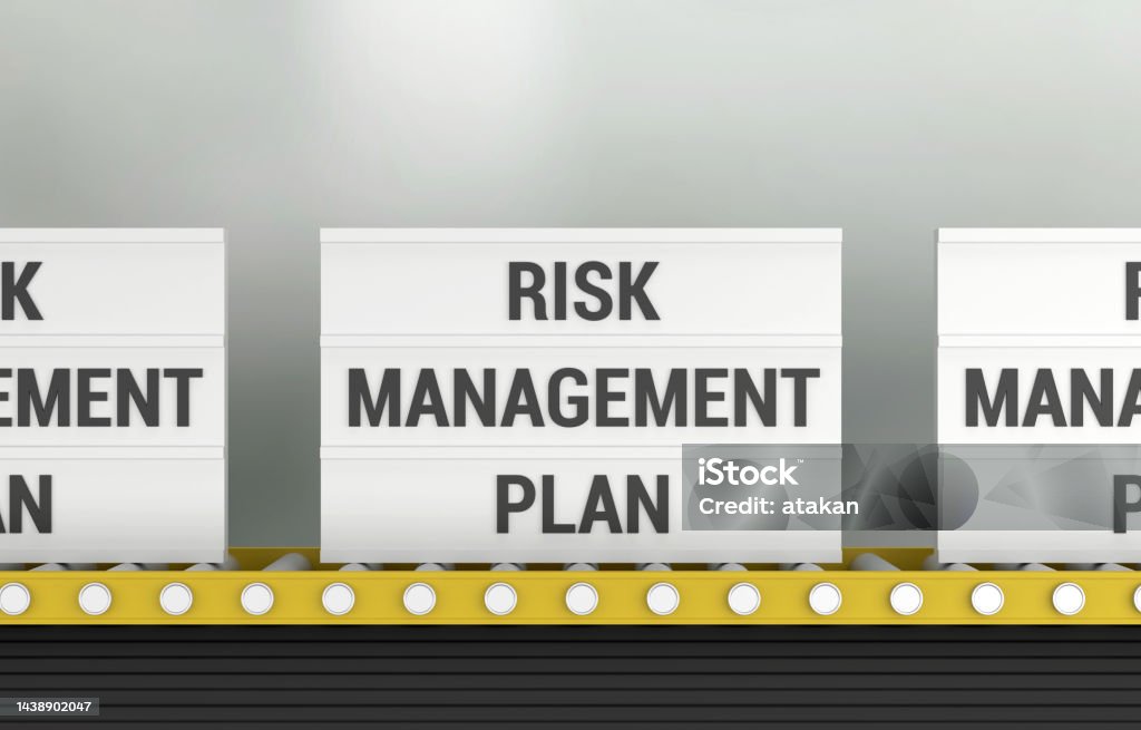 Lightbox with the word Risk Management Plan on the production line Lightbox with the word Risk Management Plan on the production line. Risk Management Concept. Abstract Stock Photo
