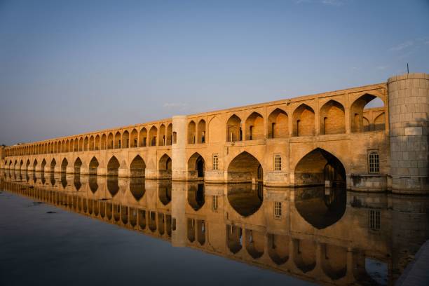 istock Allahverdi Khan Bridge reflecting on the water under a blue sky during daytime 1438903217