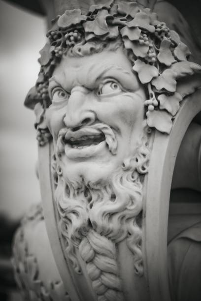 istock Vertical shot of an ancient statue on the blurry background 1438904806