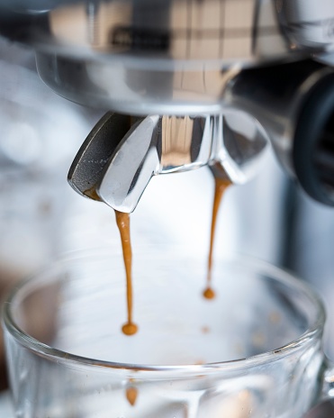 A closeup shot of fresh espresso just coming out from Breville coffee machine