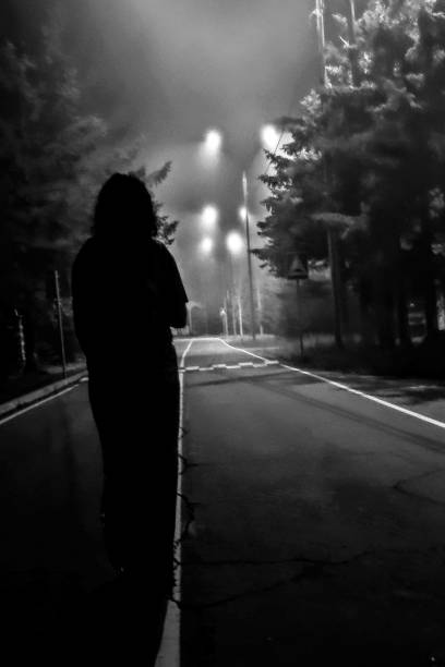 istock A silhouette in a dark alley 1438905839