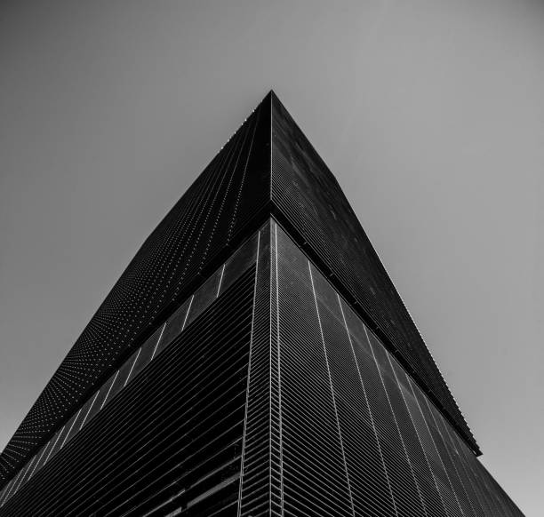 istock Low angle grayscale shot of a business building 1438907369