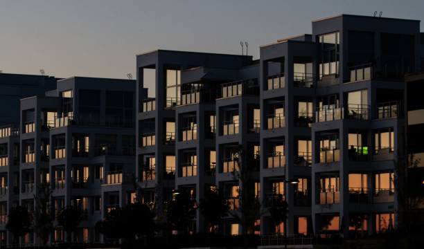 istock Concrete apartment building with reflective windows during sunset 1438907427
