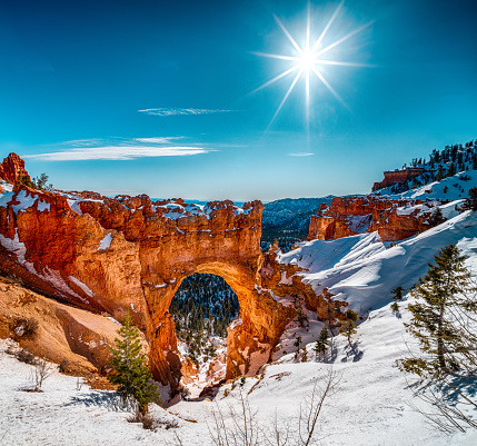 The beautiful scenery of the snowy Bryce Canyon under the shining sun