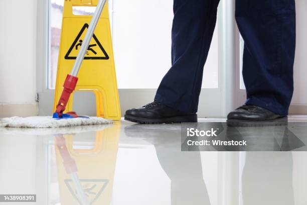 https://media.istockphoto.com/id/1438908391/photo/low-angle-closeup-of-a-person-cleaning-the-floor-with-a-mop-near-a-yellow-caution-wet-floor.jpg?s=612x612&w=is&k=20&c=HWxvbk1Rea_AtxM2xPtGioIRaSGHBtqMn8DMb0GkoC4=