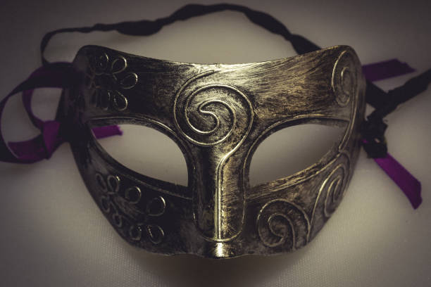 istock Closeup shot of a face mask with patterns and purple threads 1438908848