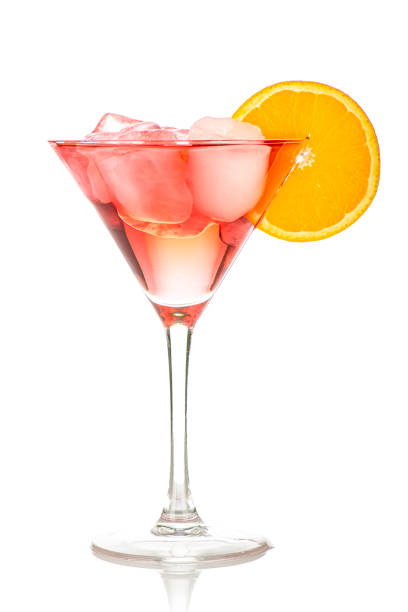 istock red drink with ice cubes and orange slice on white background, isolated 1438909400